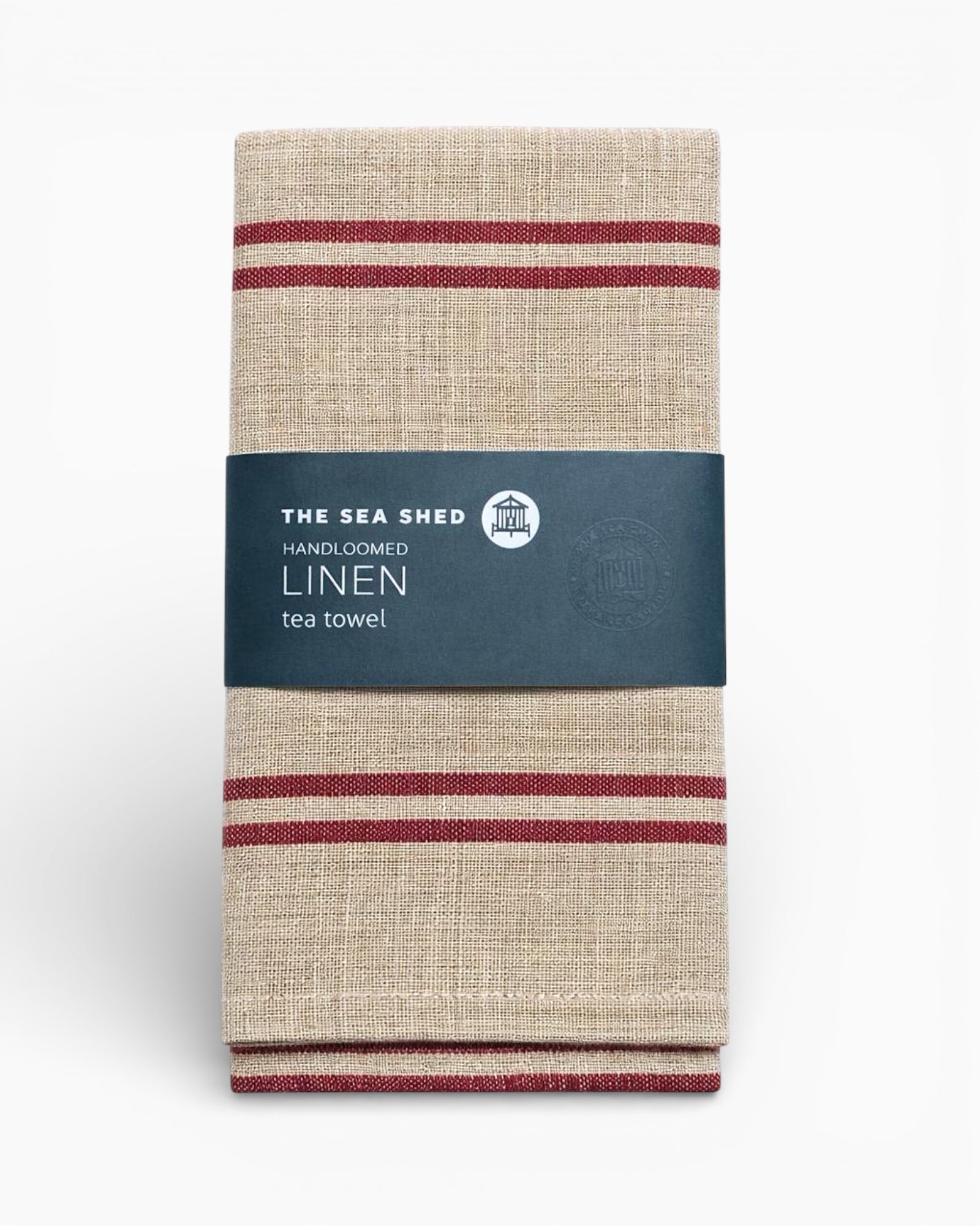 Linen tea towel with red stripes and a label on a white background. Striped linen tea towel
100% linen tea towel
Hand-loomed linen tea towel
Natural linen kitchen towel
Coastal linen tea towel
Linen dish towel UK