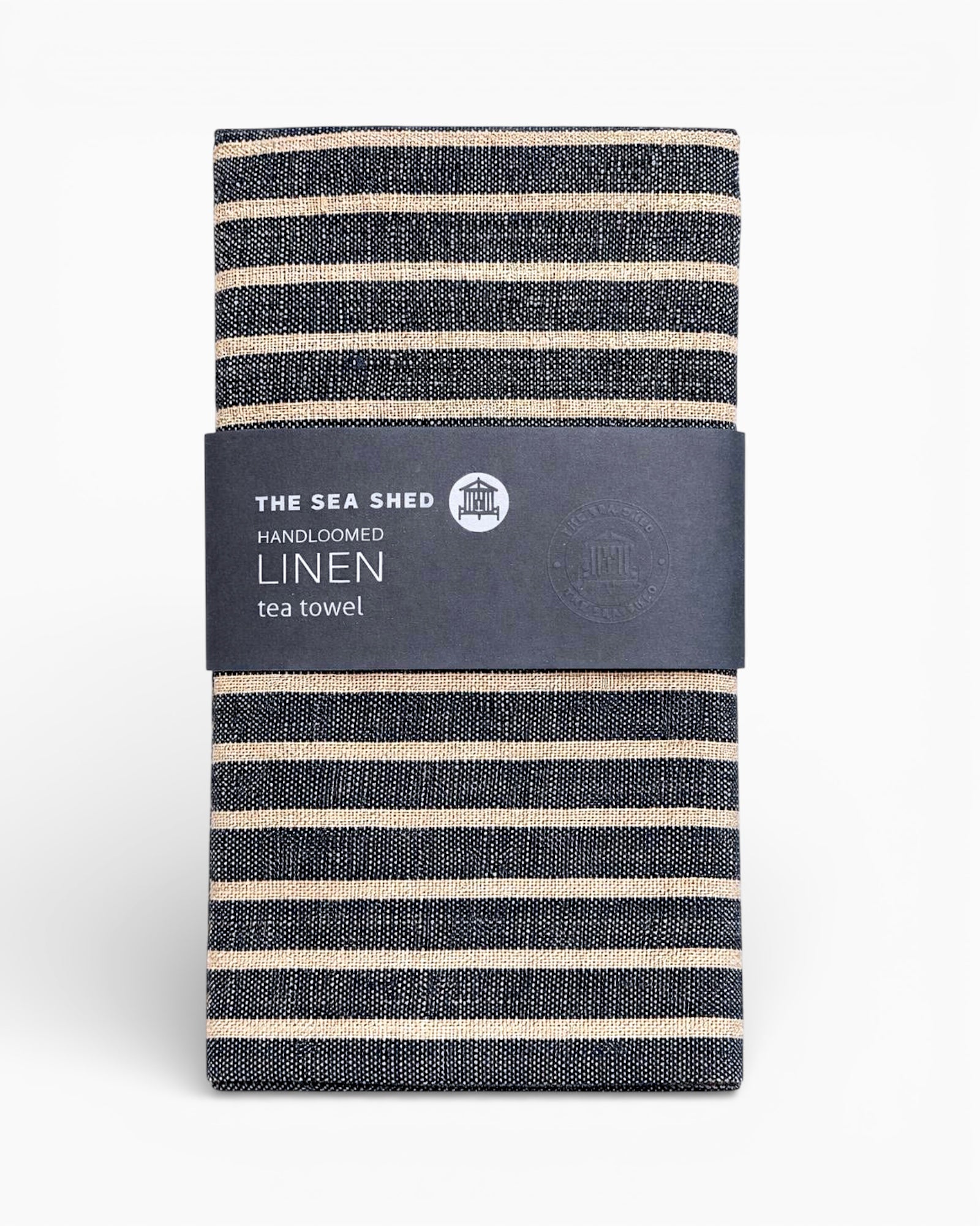Striped linen tea towel with 'The Sea Ship' label on a white background.Striped linen tea towel
100% linen tea towel
Hand-loomed linen tea towel
Natural linen kitchen towel
Coastal linen tea towel
Linen dish towel UK