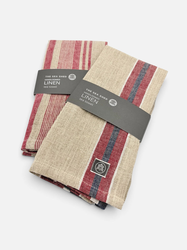 Two Sea Shed handloomed linen tea towels in red ticking stripe and red and navy stripe