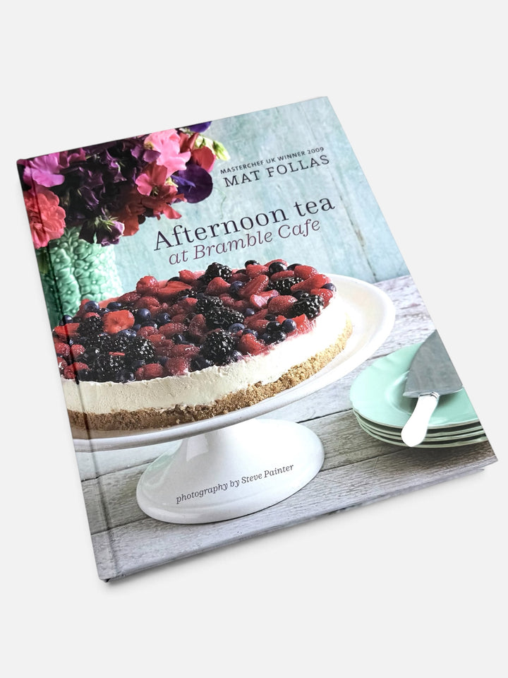 Open grey Sea Shed gift box with Afternoon Tea at Bramble Cafe book, linen tea towels and soaps