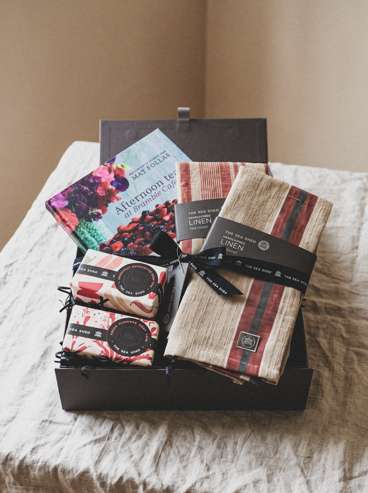 Afternoon Tea hamper in an open grey keepsake box on a linen-covered table