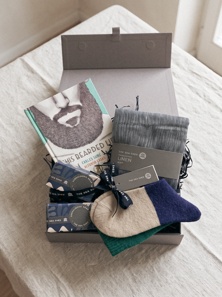Bearded Life hamper in an open grey keepsake box on a linen-covered table